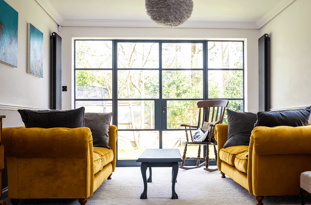 Interior shot of living room showing french doors leading to the garden