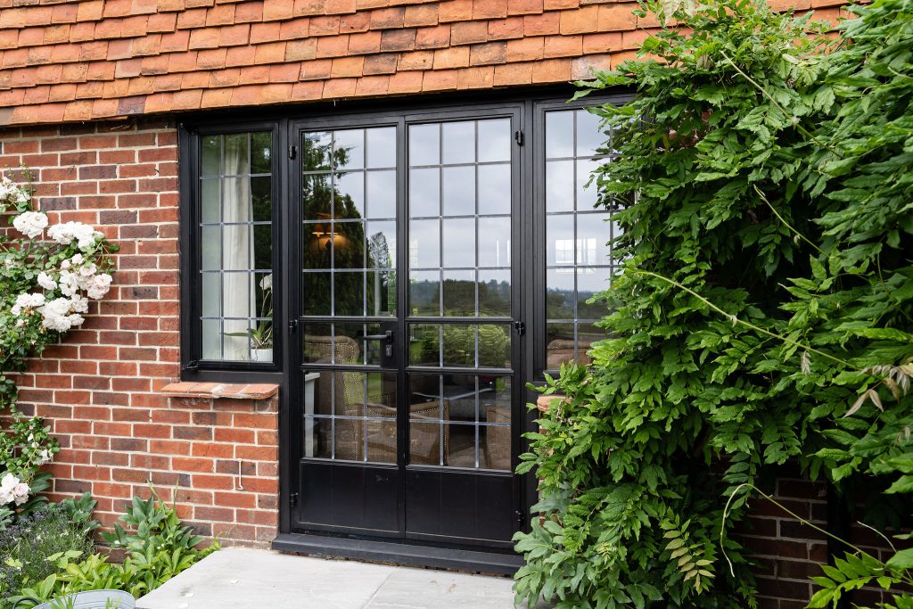 French doors with ledding leading to the lounge