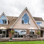 Full installation of light grey steel bespoke windows, casement windows, and french doors