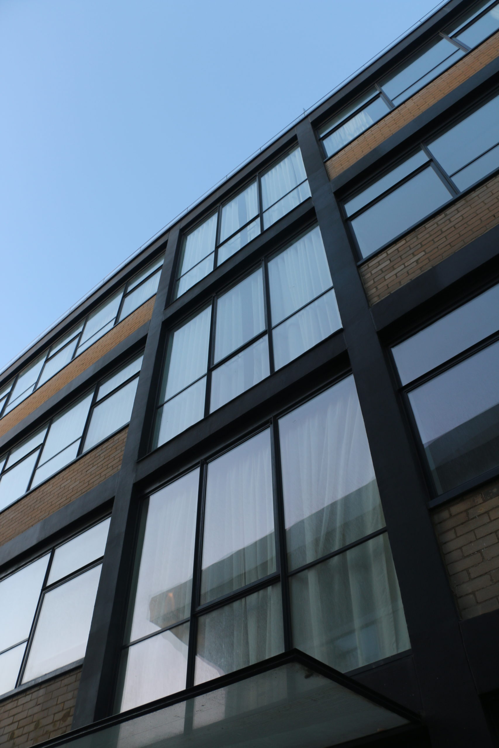 Black steel curtain walling and casement windows