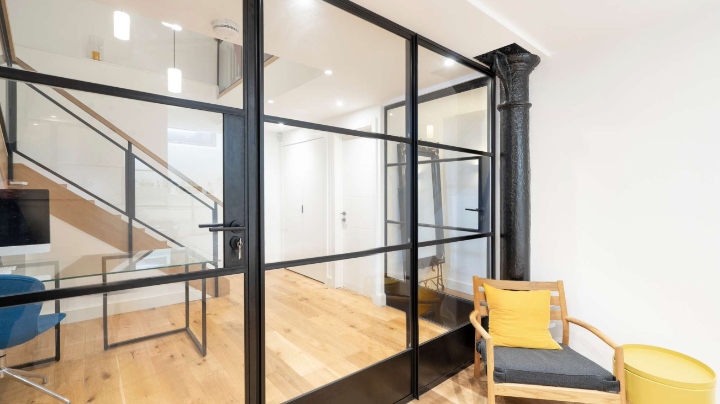 Crittall steel industrial style room divider with door.